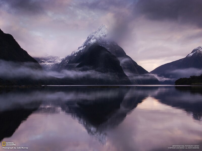 Misty mountain reflection at dawn