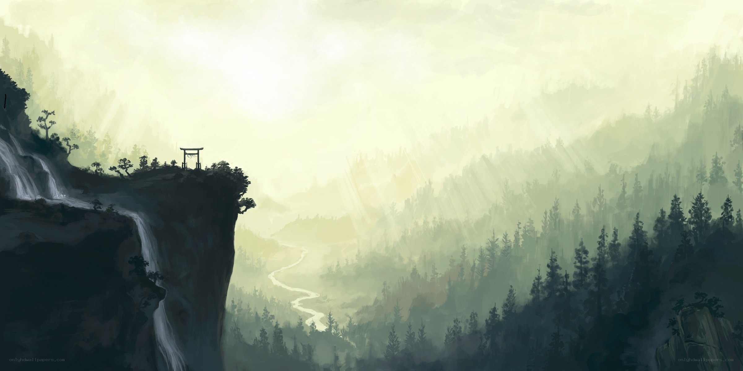 Misty mountain valley with waterfall