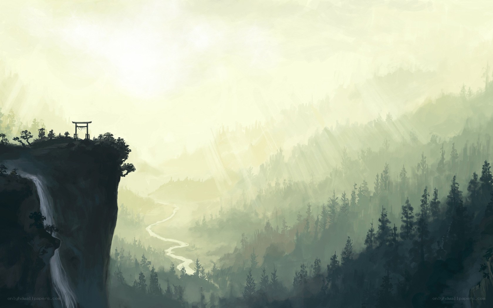 Misty mountain valley with waterfall