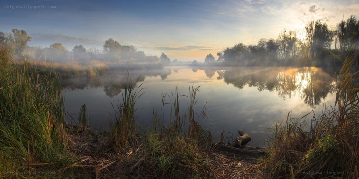 Misty river at sunrise