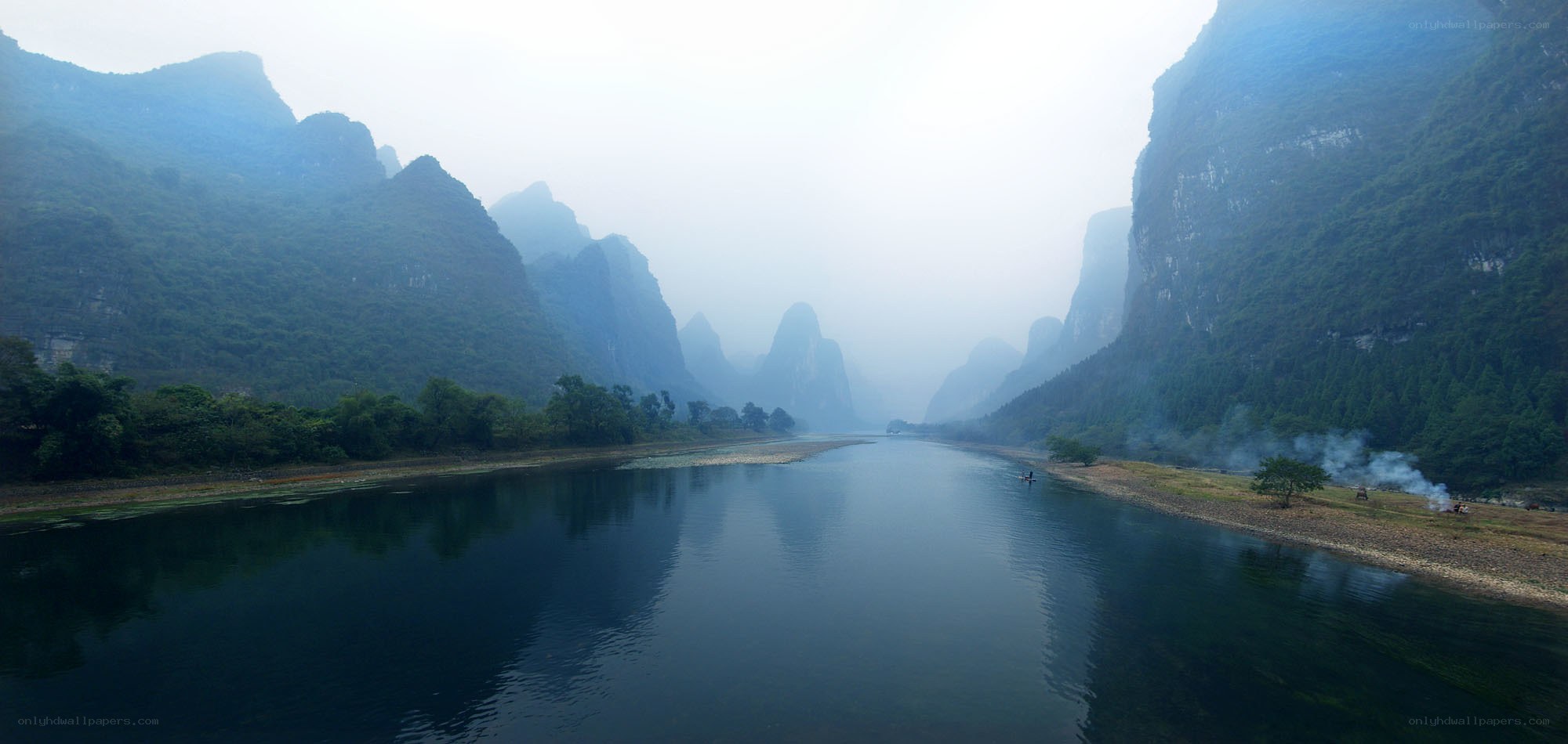 Misty river in karst mountains