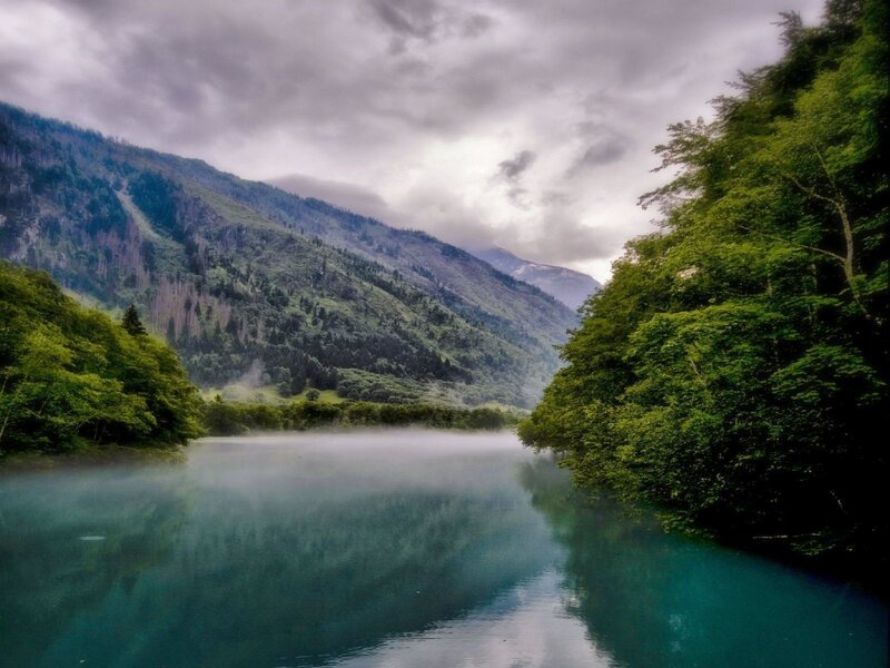 Misty river in mountain valley