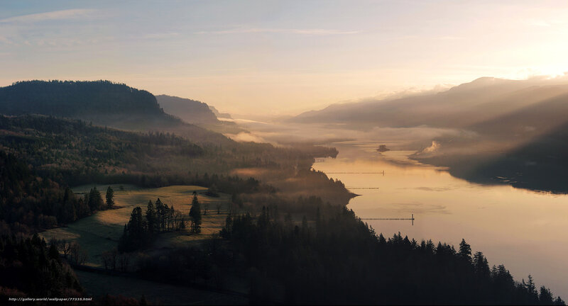 Misty river valley at sunrise