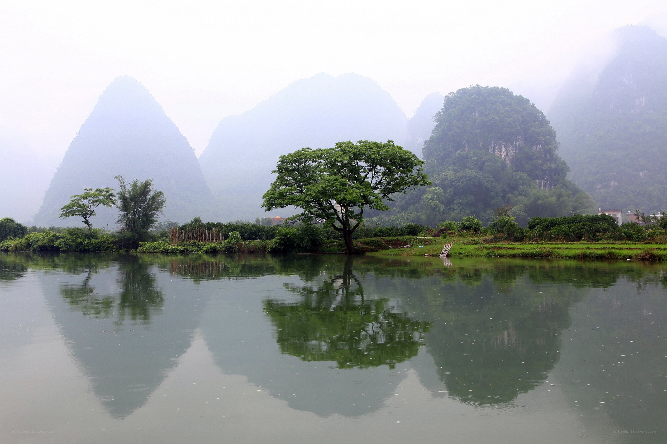 Misty river with karst mountains