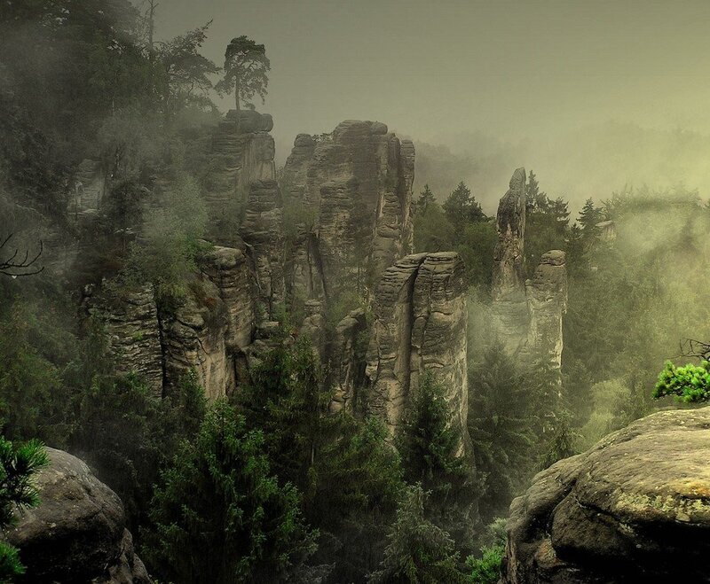 Misty rock formations in forest