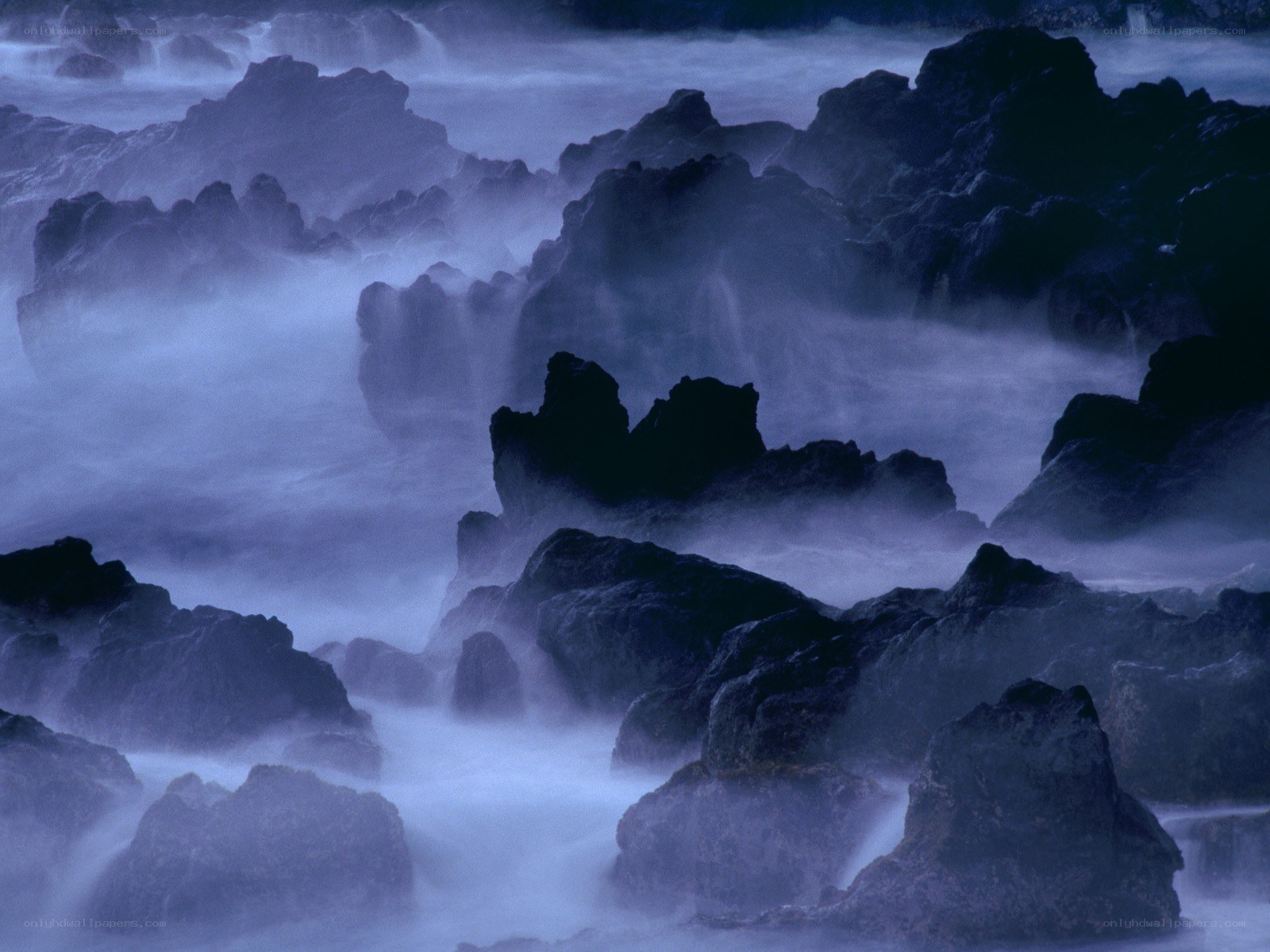 Misty rocks at the shore