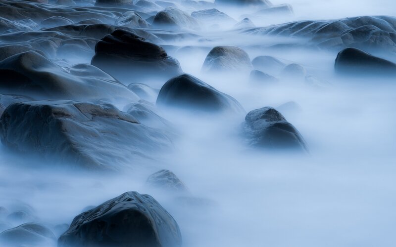 Misty rocks at the shore