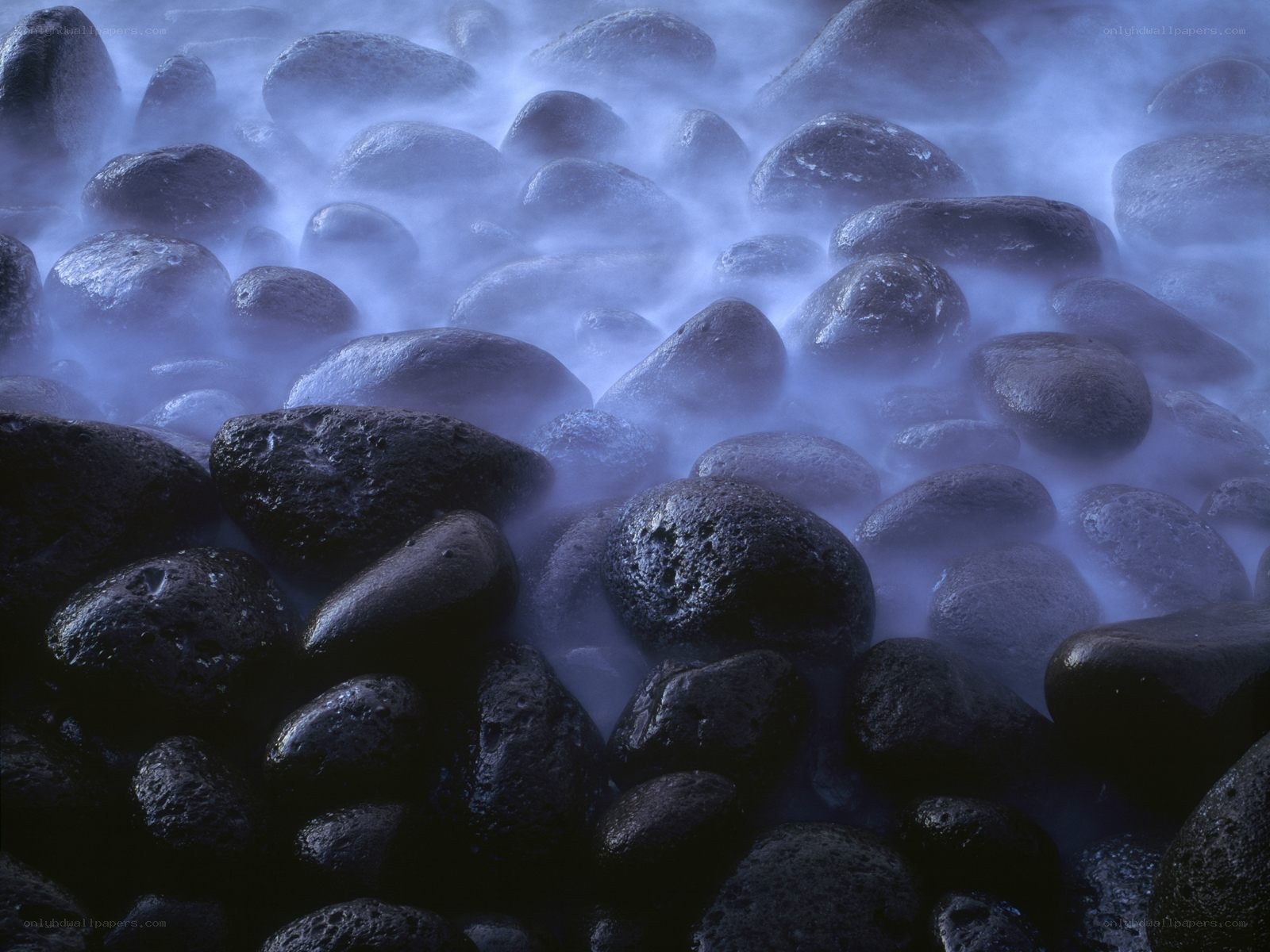 Misty rocks at the shoreline