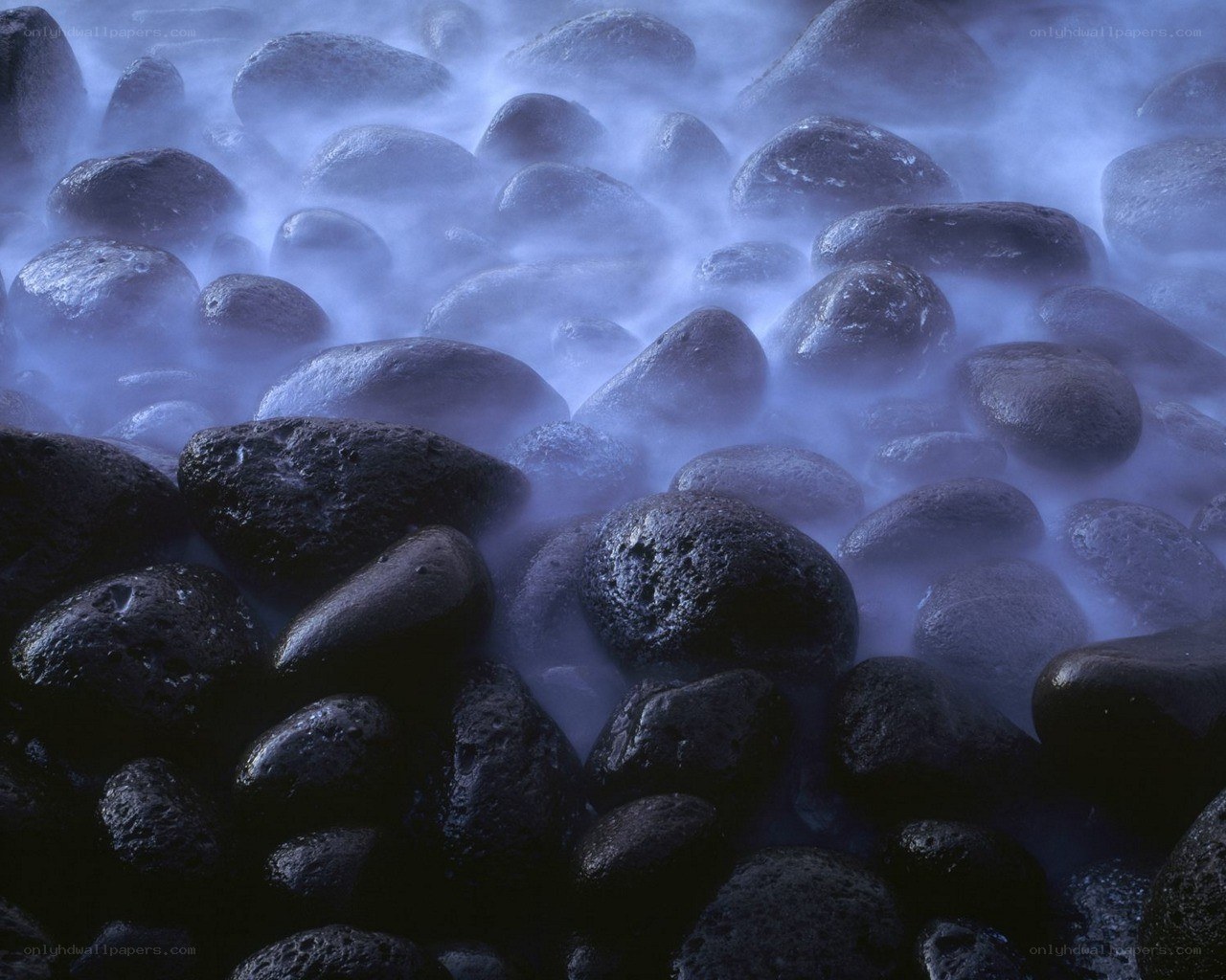 Misty rocks at the shoreline
