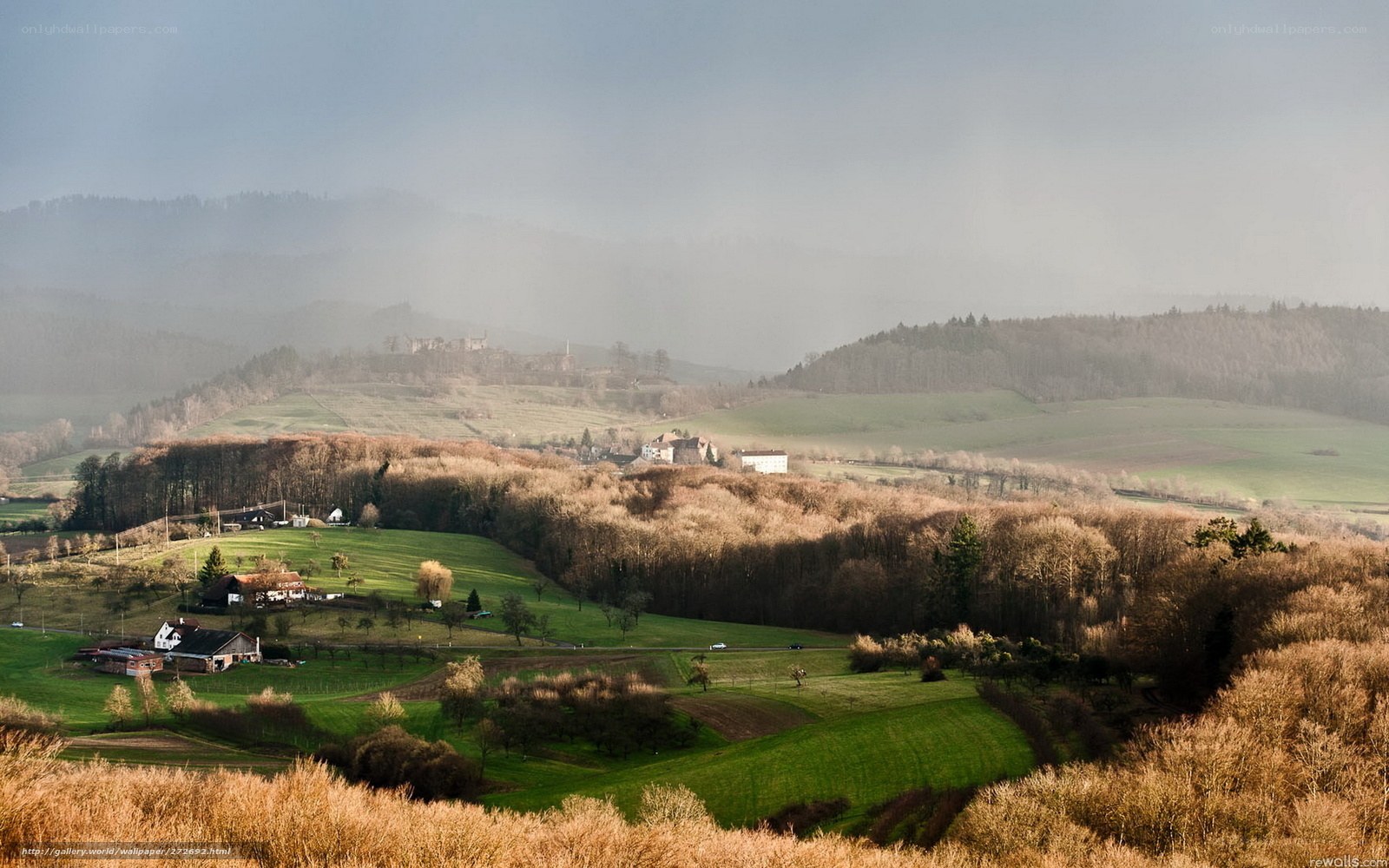 Misty valley landscape with castle