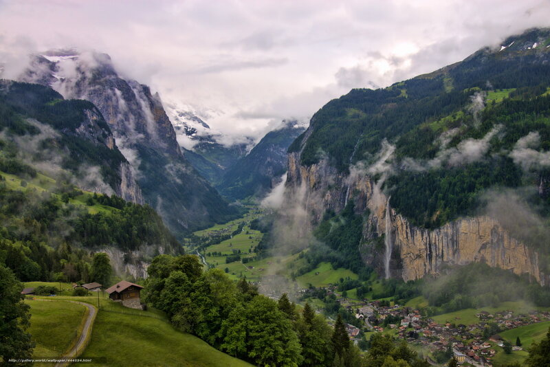 Misty valley with waterfall