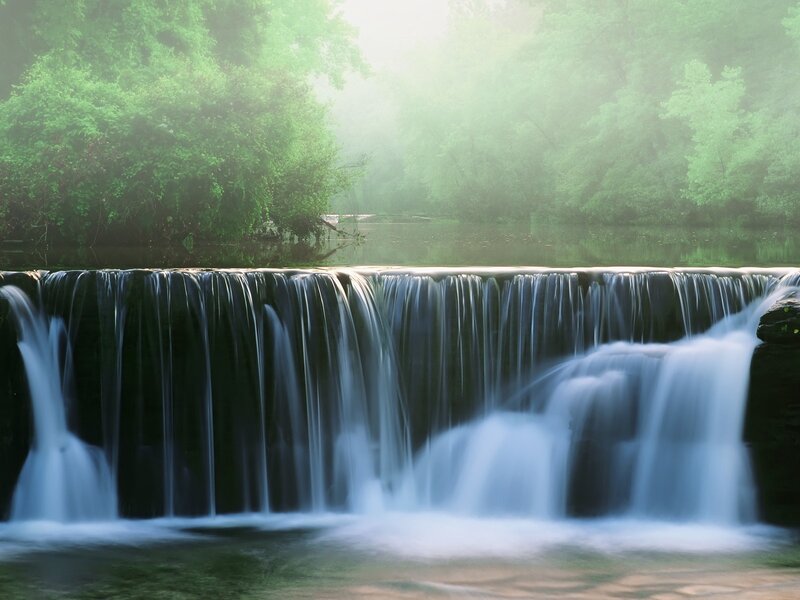 Misty waterfall in forest