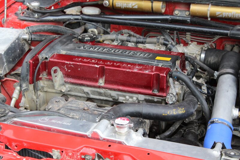 Mitsubishi Engine Bay — Red, Mechanical, Photograph