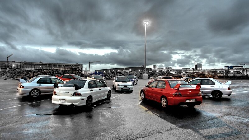 Mitsubishi Lancer Evolution cars in parking lot