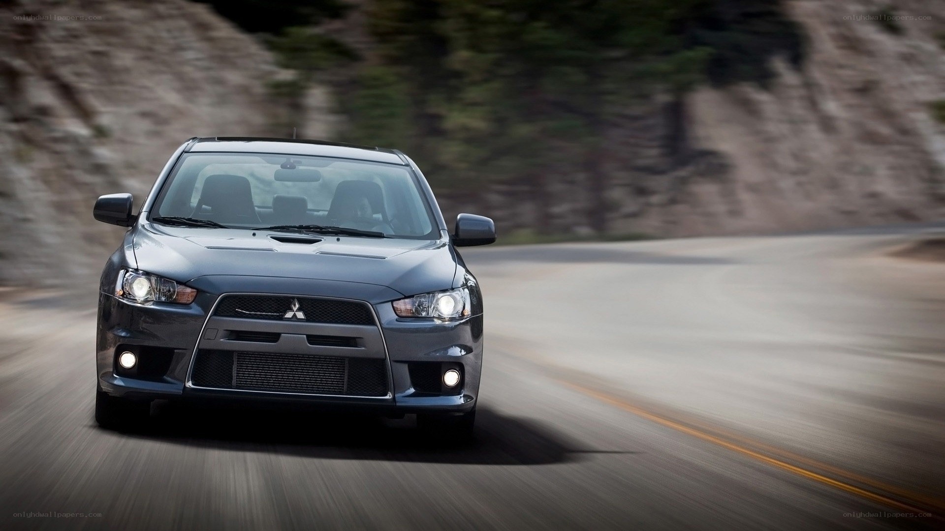 Mitsubishi Lancer Evolution on a winding road