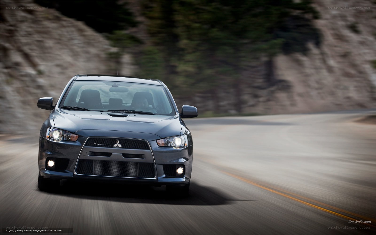 Mitsubishi Lancer Evolution on a winding road