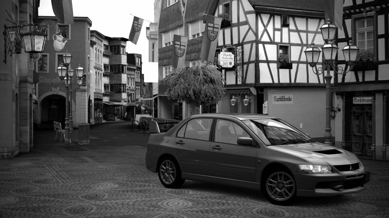 Mitsubishi Lancer on a cobblestone street