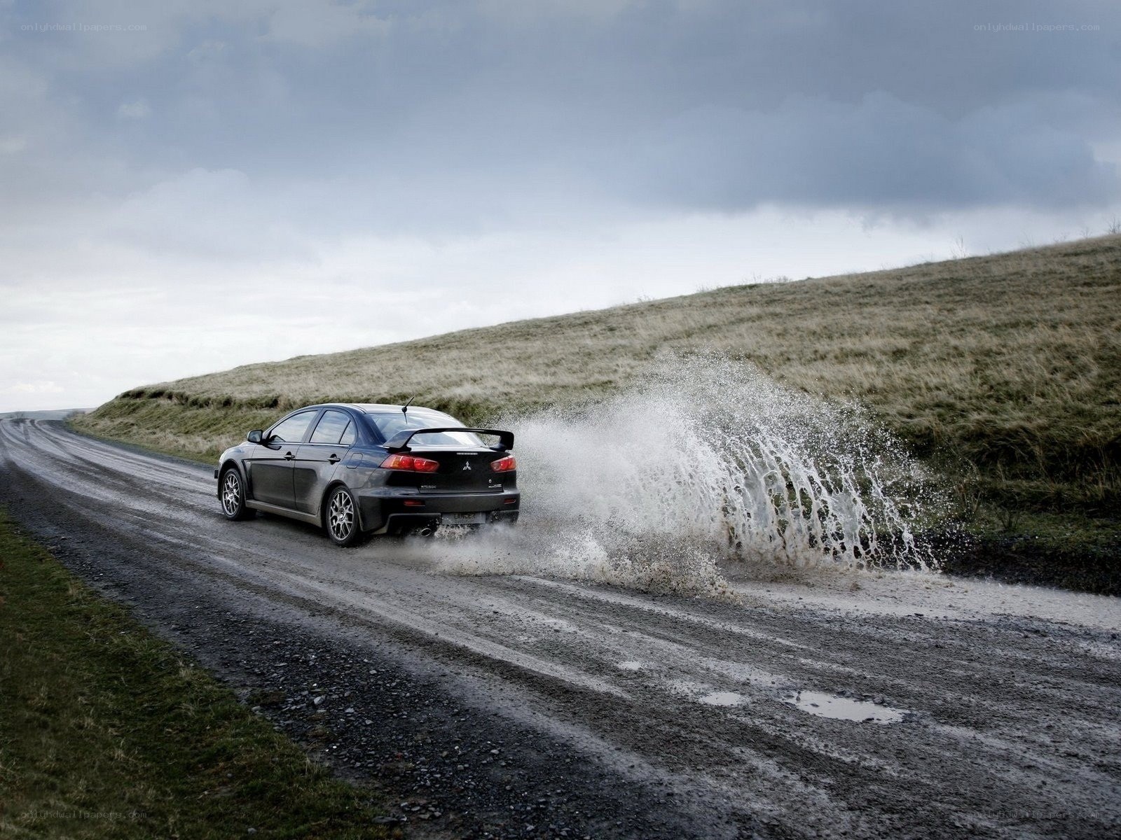 Mitsubishi Lancer on muddy road