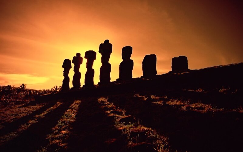 Moai Statues at Sunset — Orange, Dramatic, Photograph, Sky, Hill, Black
