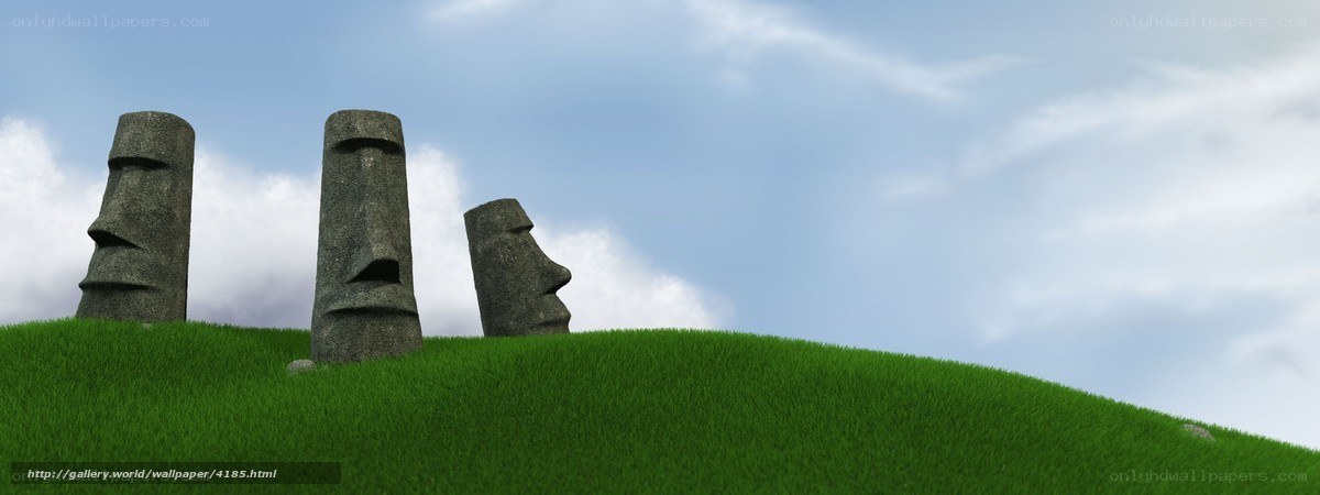 Moai statues on a grassy hill