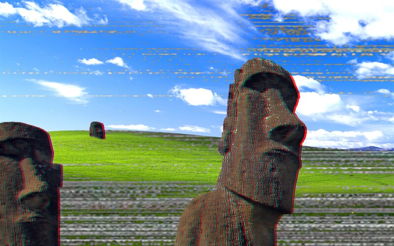 Moai Statues on Grassy Field