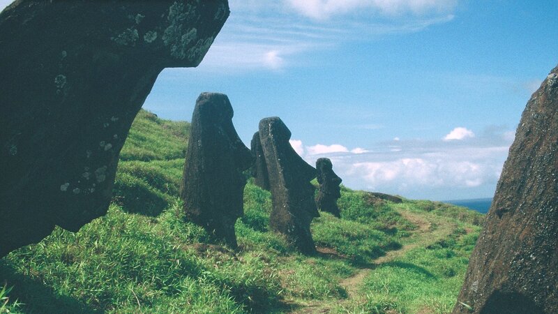 Moai Statues on Hillside — Green, Serene, Afternoon, Photograph, Grass, Sky, Ocean