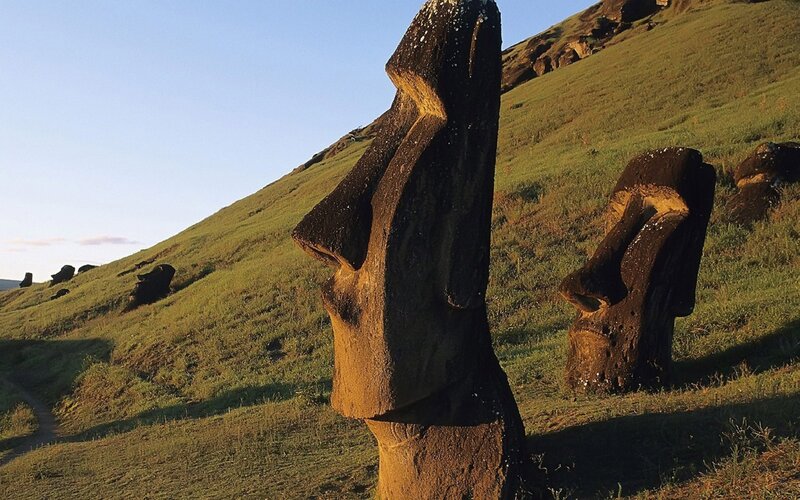 Moai Statues on Hillside — Green, Serene, Afternoon, Photograph, Grass, Sky, Sculptures