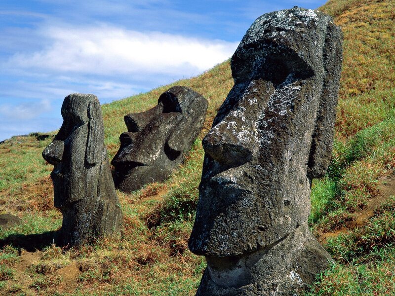 Moai Statues on Hillside — Green, Serene, Afternoon, Photograph, Grass, Sky