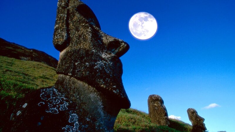 Moai statues under full moon
