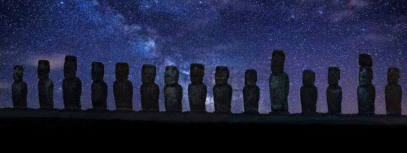 Moai statues under starry sky