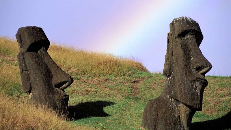 Moai statues with rainbow
