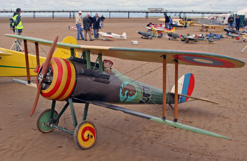 Model airplanes on a beach