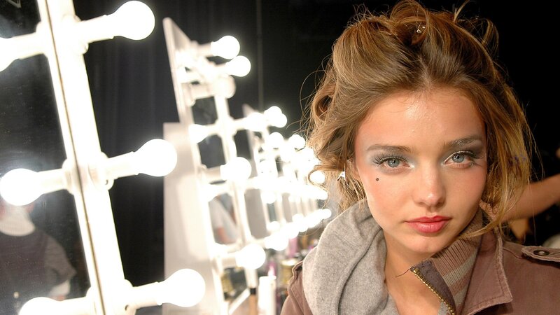 model backstage at fashion show