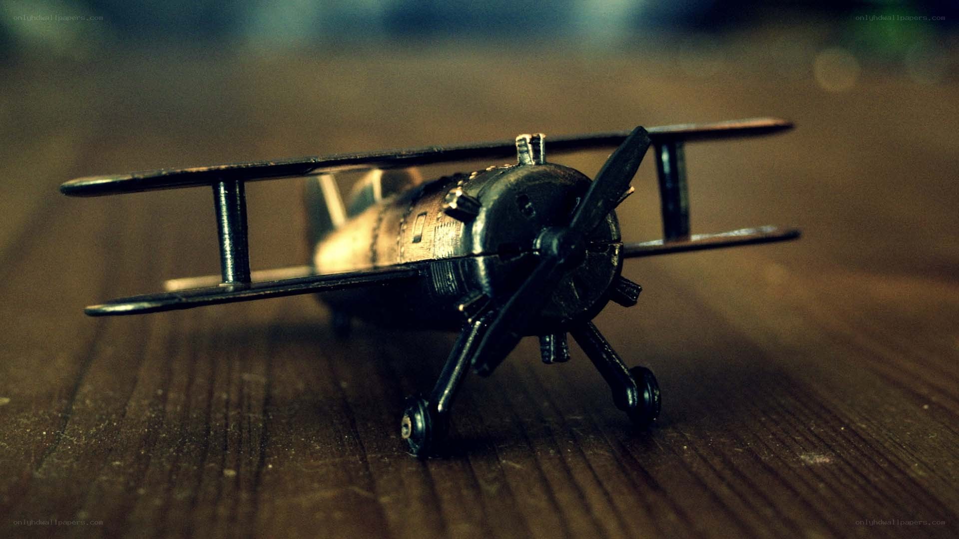 model biplane on wooden surface