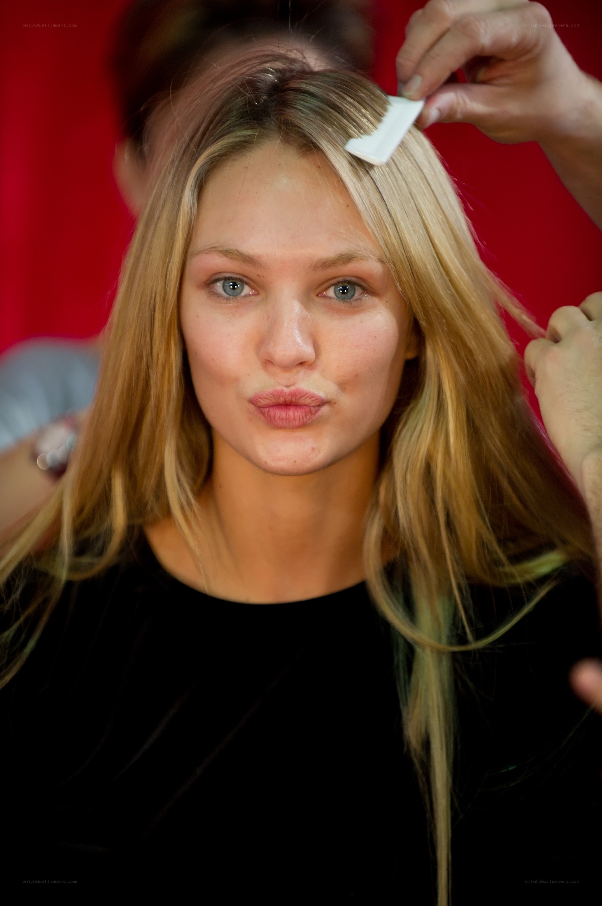 model getting hair styled