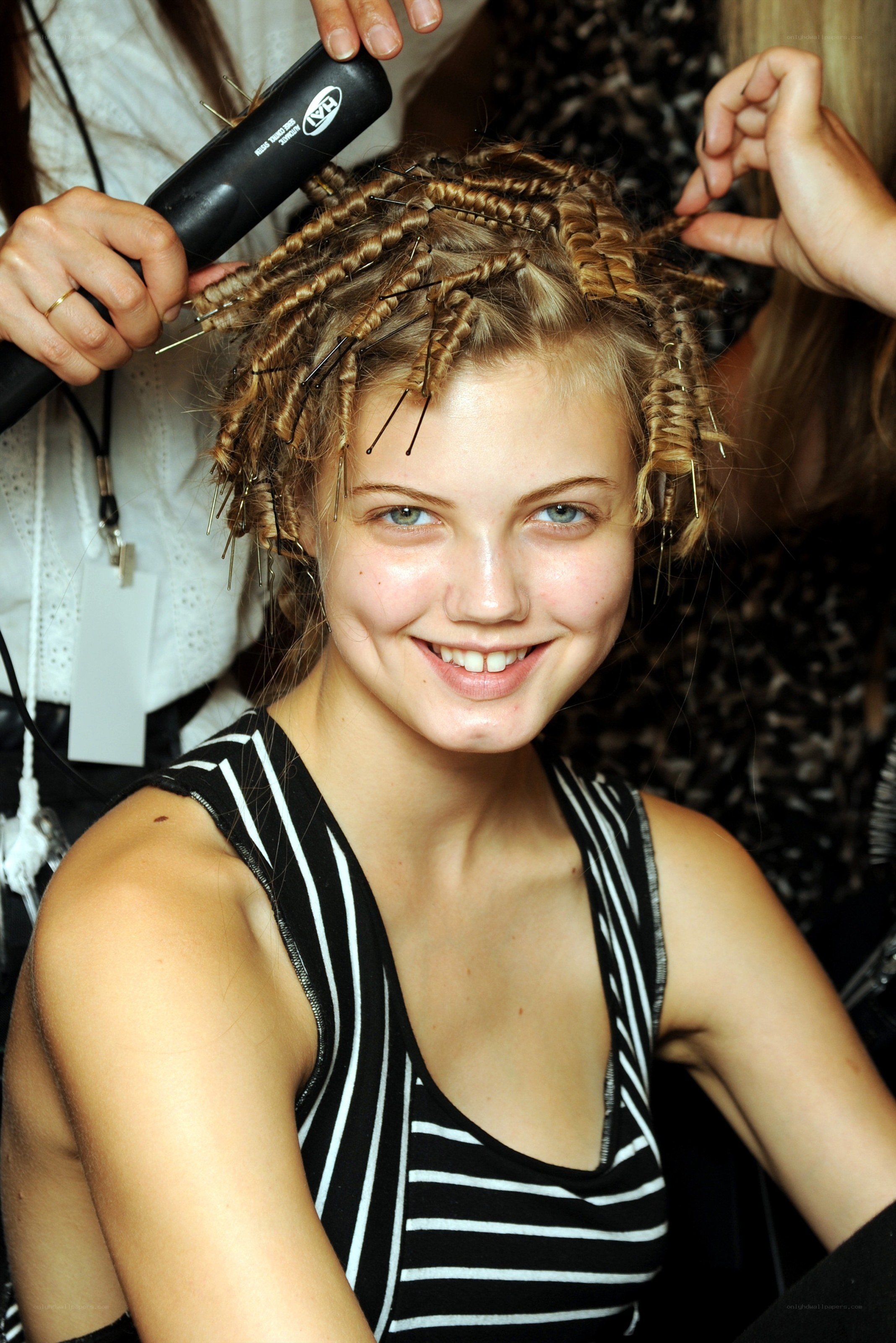 model getting hair styled