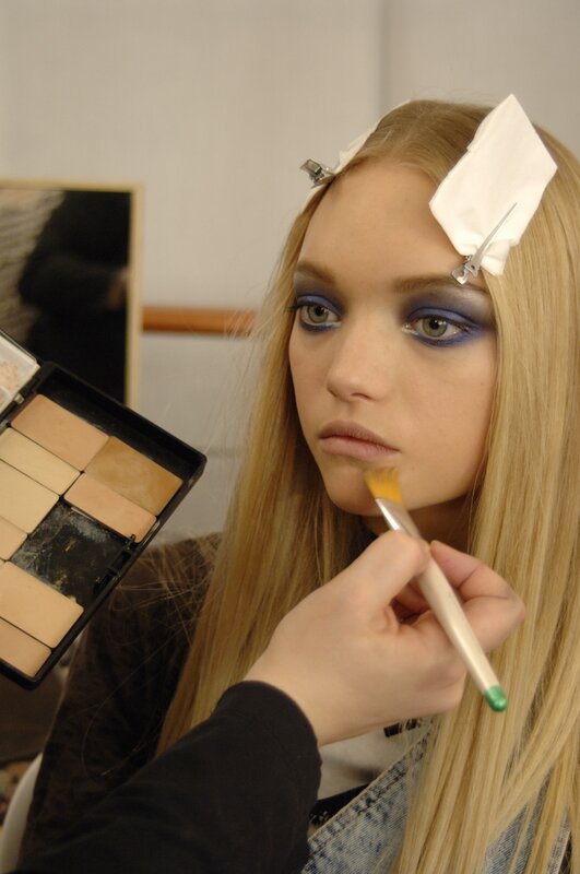 Model Getting Makeup Applied — Blonde