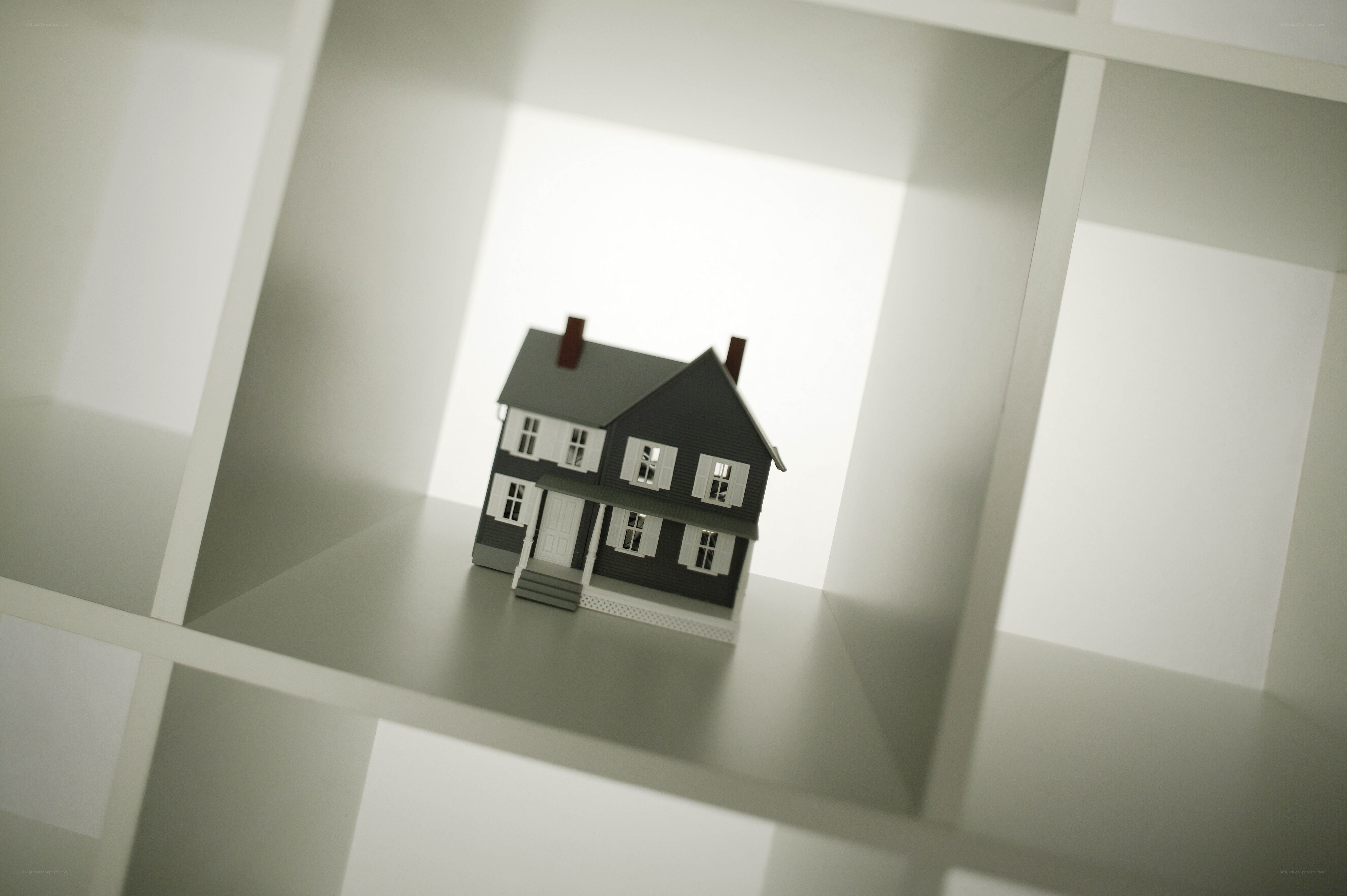 model house in white shelf