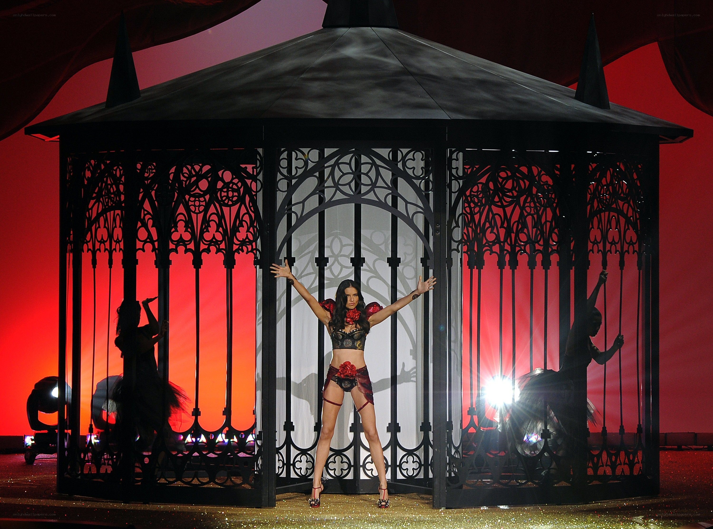 Model in a cage on stage