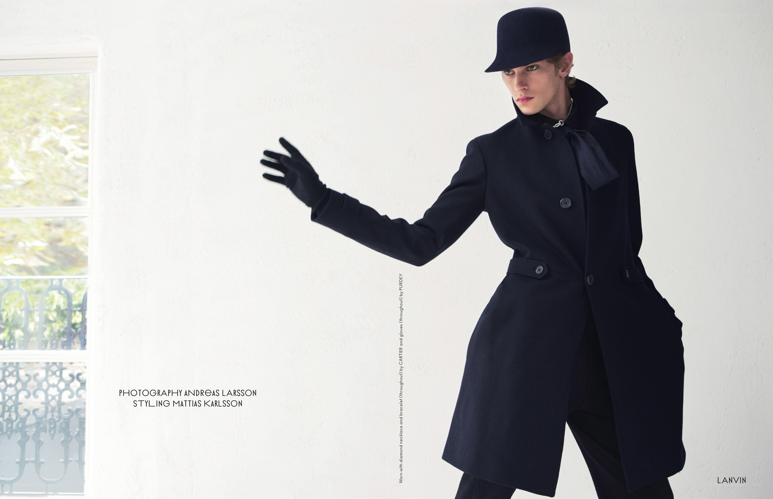 model in black coat and hat