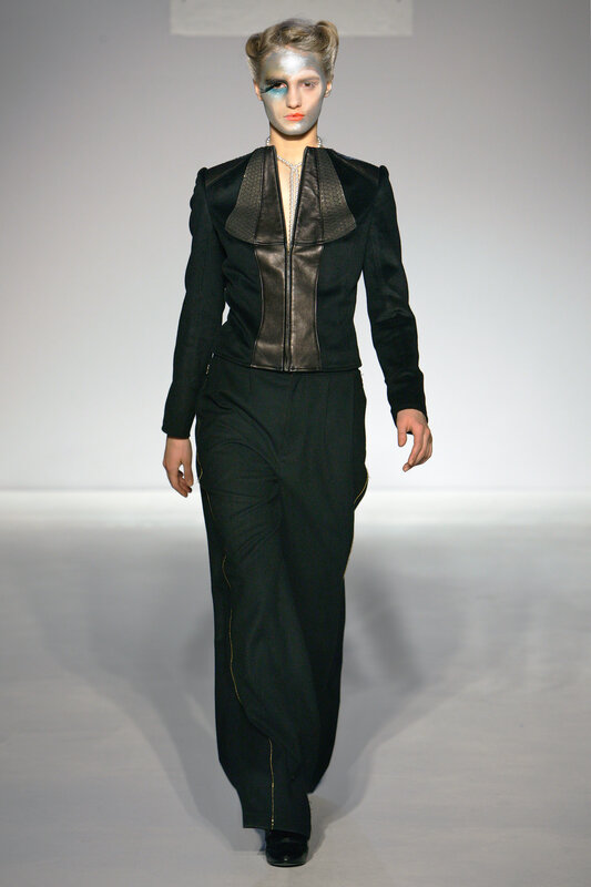 model in black fashion suit