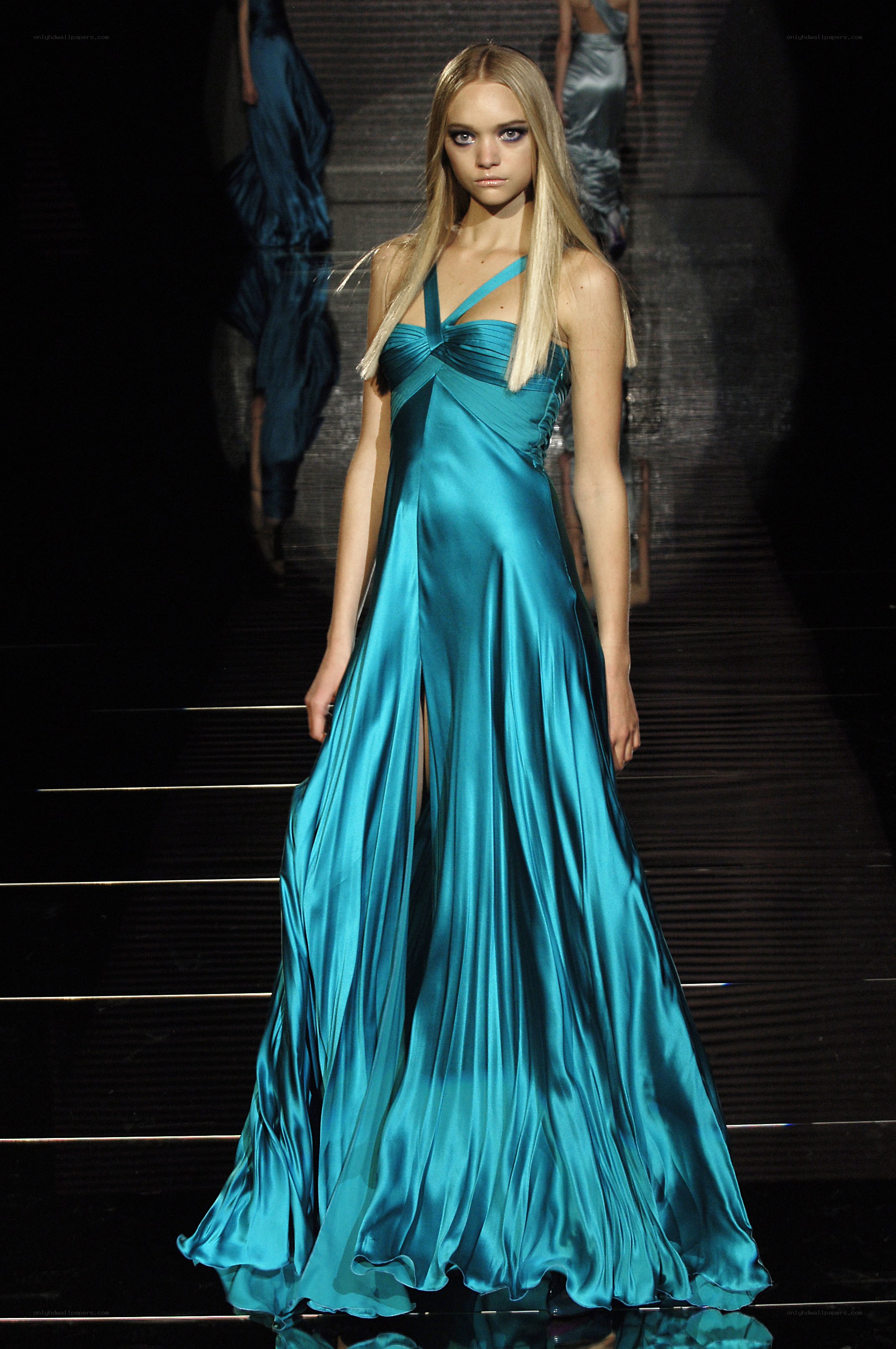 Model in blue satin gown
