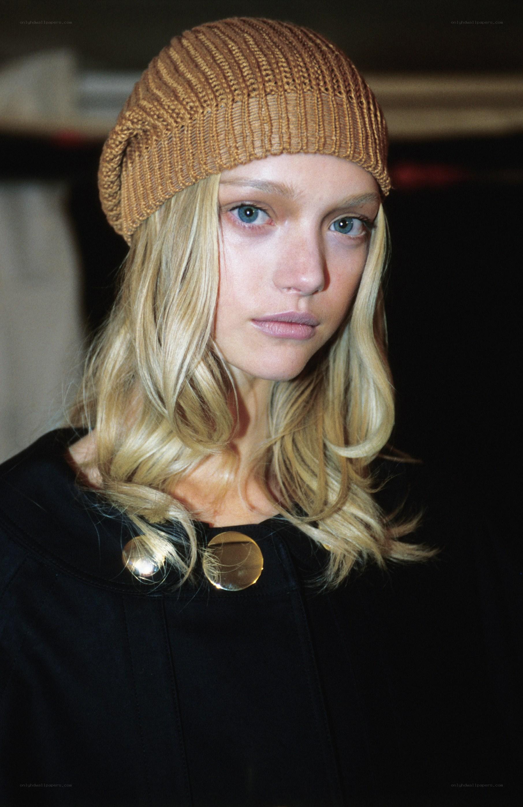 model in brown beanie