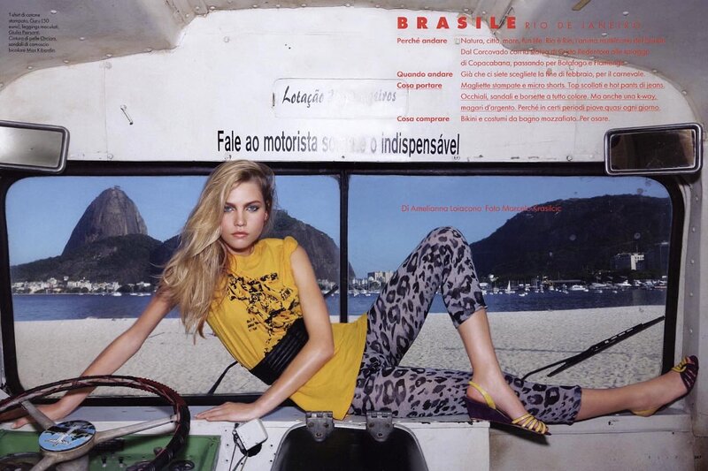 Model in bus with Rio backdrop