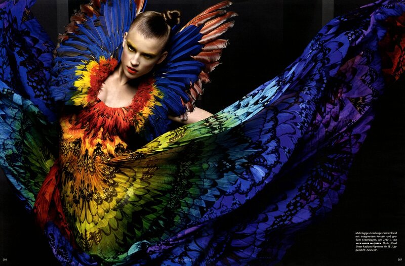 model in colorful feather costume