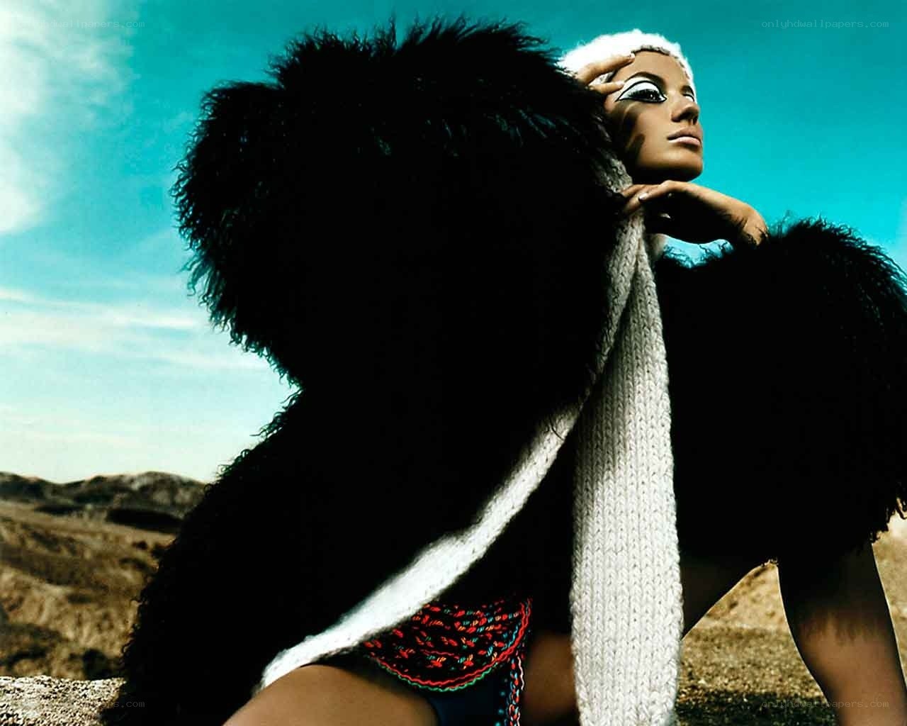model in desert with fur coat