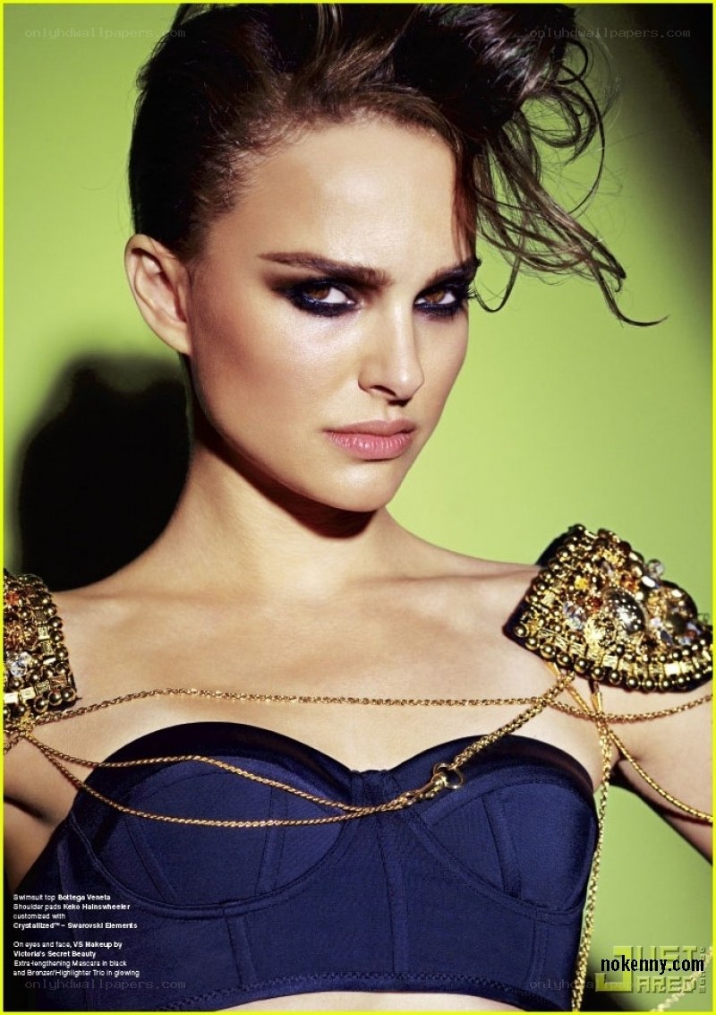 model in embellished swimsuit