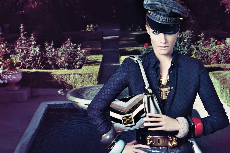 model in garden with handbag