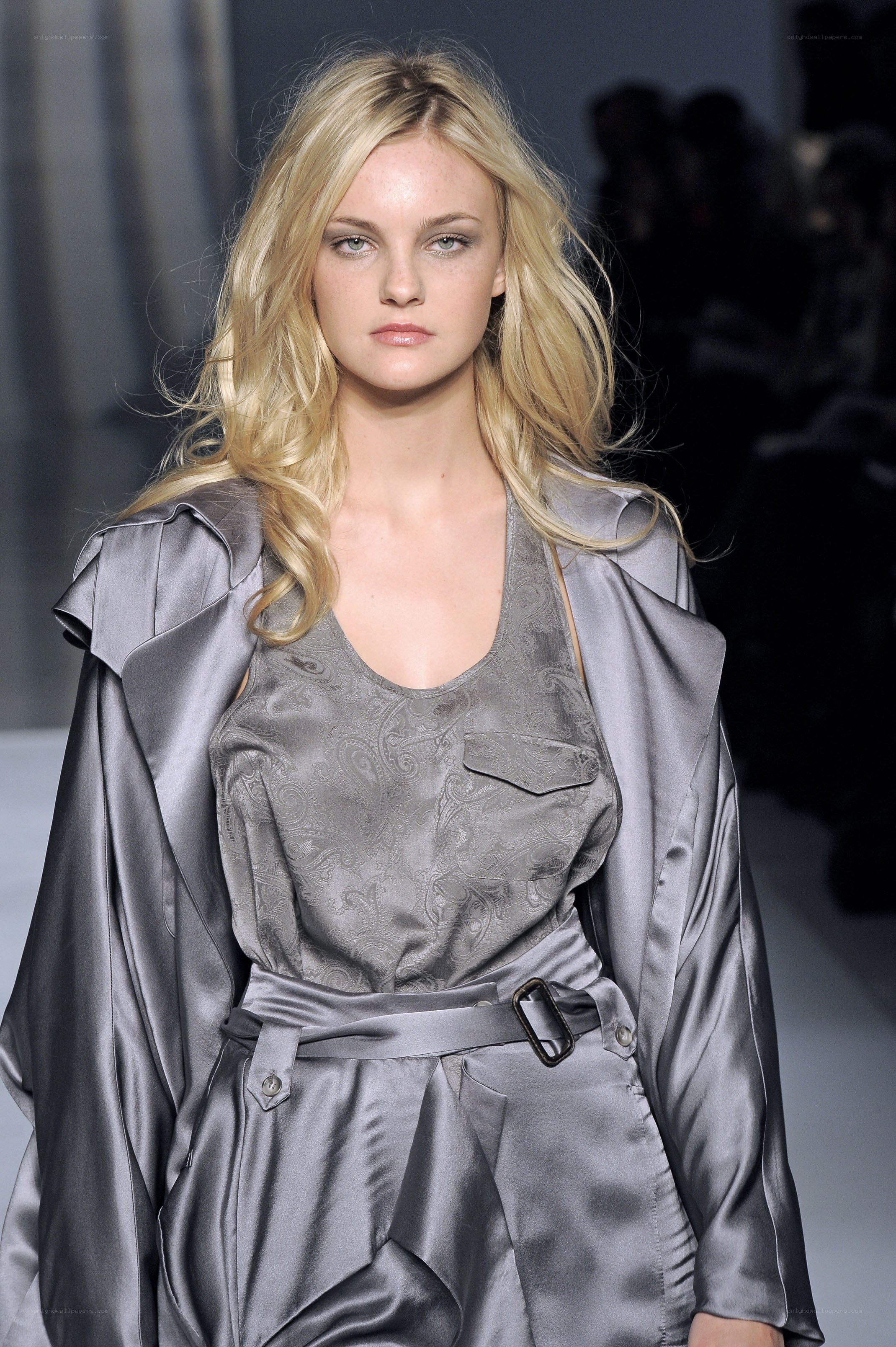 model in gray satin outfit