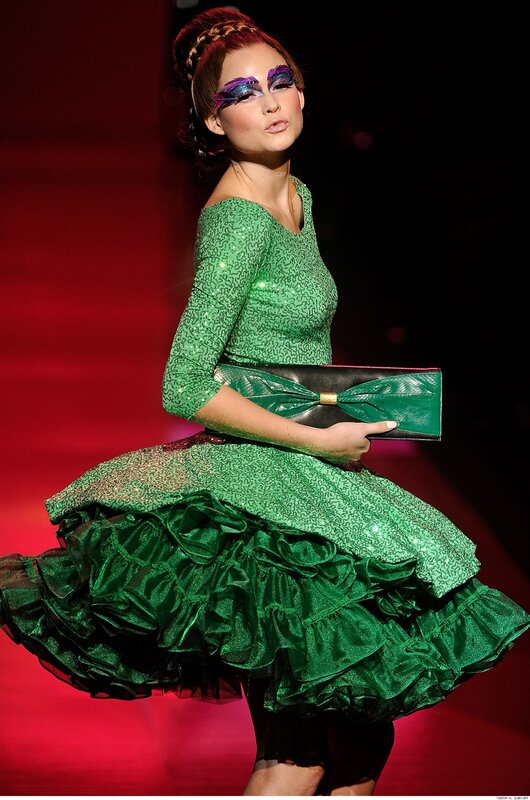 Model in green sequined dress